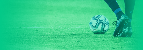 Player Kicking Football